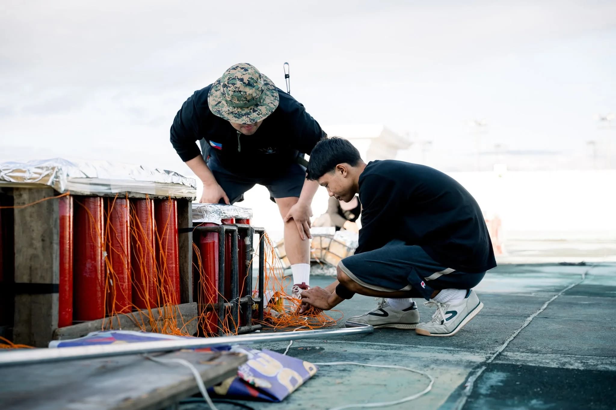 Connecting and tidying the firing wires on a bank of shells